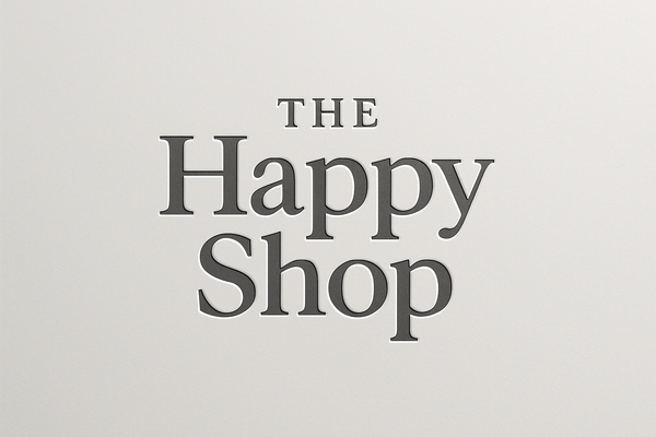 Photo logo for company with text “The Happy Shop” gray and white colors